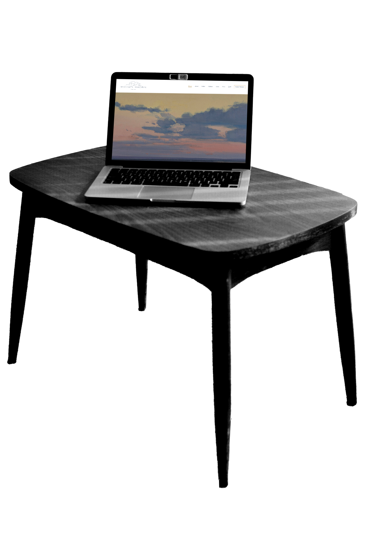 laptop-desk-website-layout A laptop on a modern table showcasing a client's website as velvet fern's portfolio