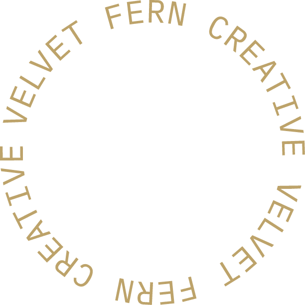 Designed circle brand logo with "Velvet Fern Creative"in light gold color.